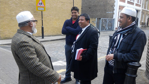 Labour Party member leafletting in Tower Hamlets