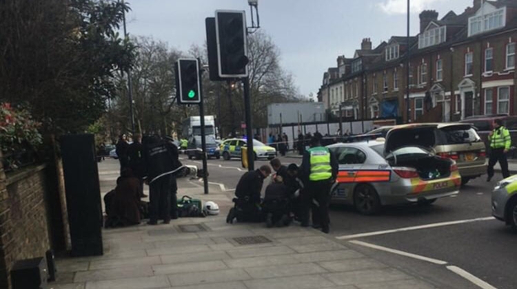 Met Police and First Aid officials on the scene of a moped collision in Hackney. Pic: @999London