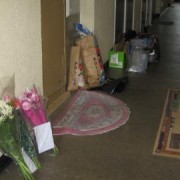 Floral tributes and forensic evidence outside Irene Barrett's flat. Photo: Thuto Mali.