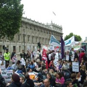 Demonstrators sit down outside Whitehall. Photo: James Masters