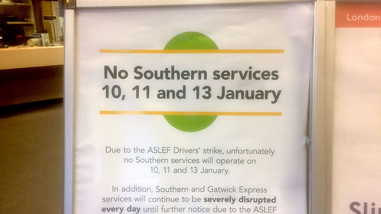 Notice board at New Cross Gate station alerting commuters of strikes.