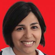 headshot of Hamida Ali on a red background