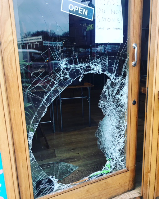 Vandalised door of Masala Wala Cafe