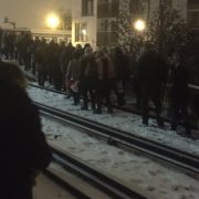 Passengers walking along snow-covered train tracks in Lewisham. Pic: Nina Bevan @ninaEbevan